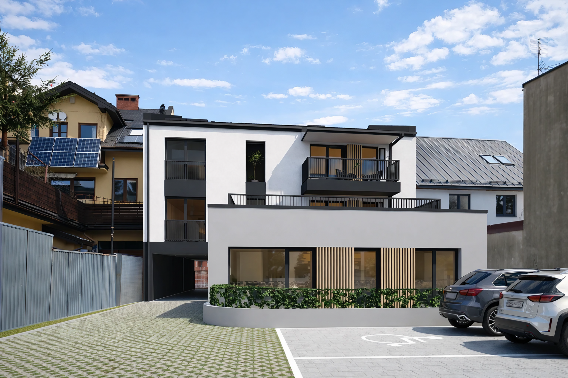 "Nowoczesny budynek wielorodzinny z 9 mieszkaniami pod wynajem w Nowym Targu - elewacja włókno-cementowa, zabudowa zwarta"